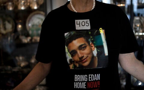 Varda Ben Baruch, whose grandson Edan Alexander is held hostage in the Gaza Strip by Hamas terrorists, wears tape marking the days since his capture, at her home in Tel Aviv, November 14, 2024. (AP Photo/Maya Alleruzzo)