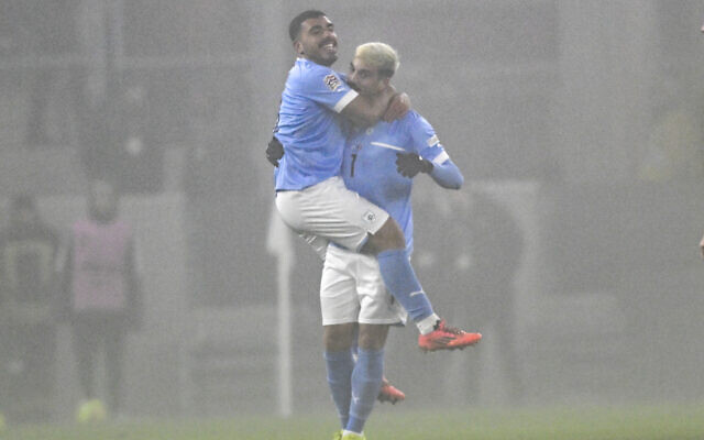 Israel's Yarden Shua, right, celebrates after scoring his side's opening goal during the UEFA Nations League Group A2 soccer match between Israel and Belgium at the Bozsik Arena stadium in Budapest, Hungary, November 17, 2024. (AP Photo/ Denes Erdos) Israel's Yarden Shua, right, celebrates after scoring his side's opening goal during the UEFA Nations League Group A2 soccer match between Israel and Belgium at the Bozsik Arena stadium in Budapest, Hungary, November 17, 2024. (AP Photo/ Denes Erdos)