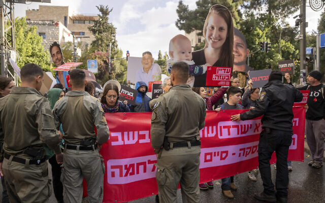 Families and supporters of hostages held by Hamas in Gaza, hold photos of their loved ones during a protest calling for their release outside the prime minister's house in Jerusalem, Monday, Nov. 18, 2024. (AP Photo/Ohad Zwigenberg) Families and supporters of hostages held by Hamas in Gaza, hold photos of their loved ones during a protest calling for their release outside the prime minister's house in Jerusalem, Monday, Nov. 18, 2024. (AP Photo/Ohad Zwigenberg)