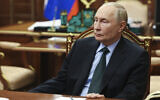 Russian President Vladimir Putin listens to Moscow-appointed head of Russian-controlled Zaporizhzhia region of Ukraine, Yevgeny Balitsky during their meeting at the Kremlin in Moscow, Russia, November 18, 2024. (Vyacheslav Prokofyev, Sputnik, Kremlin Pool Photo via AP)