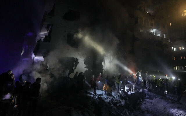 Rescue workers and people search for victims at the site of an Israeli airstrike in Beirut, early November 23, 2024. (AP Photo/Bilal Hussein) Rescue workers and people search for victims at the site of an Israeli airstrike in Beirut, early November 23, 2024. (AP Photo/Bilal Hussein)
