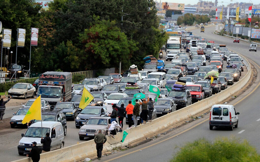 People sit in traffic as they return to their villages after a ceasefire between Israel and Hezbollah went into effect in Ghazieh, Lebanon, November 27, 2024. (AP/Mohammed Zaatari)