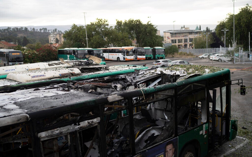 A damaged bus hit by a rocket fired from Lebanon during the night is parked at a bus station in Kiryat Shmona, on Wednesday, Nov. 27, 2024. (AP/Leo Correa)