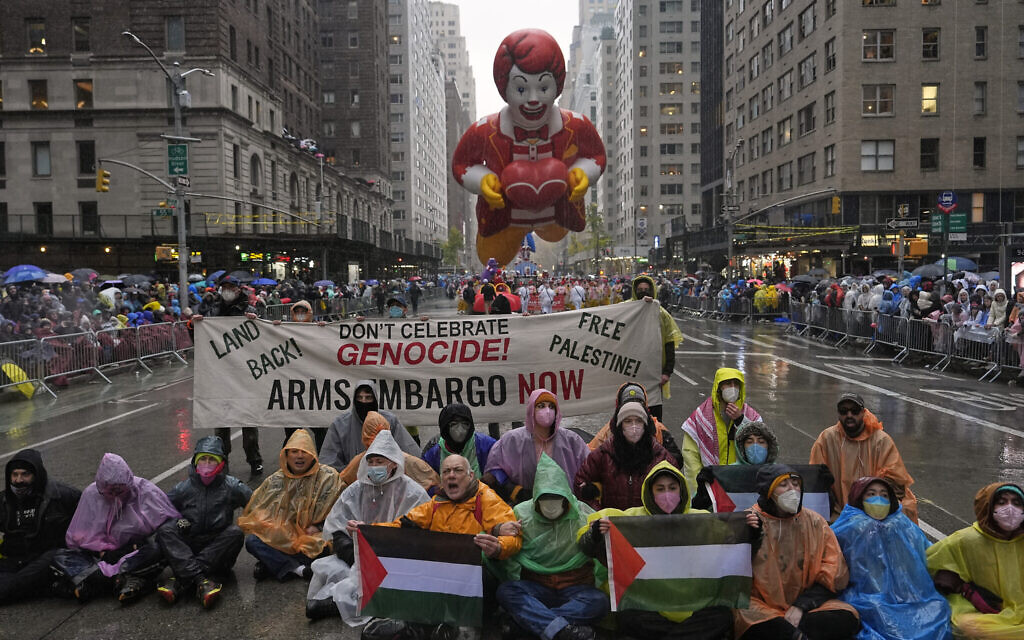 Pro-Palestinian, anti-Israel protesters demonstrate on Sixth Avenue during the Macy's Thanksgiving Day Parade, Thursday, Nov. 28, 2024, in New York. (AP Photo/Julia Demaree Nikhinson)
