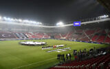 Players line up prior to the kick-off at the Europa League opening phase soccer match between Besiktas and Maccabi Tel Aviv, at the Nagyerdei Stadium in Debrecen, Hungary, November 28, 2024. (AP/Denes Erdos)