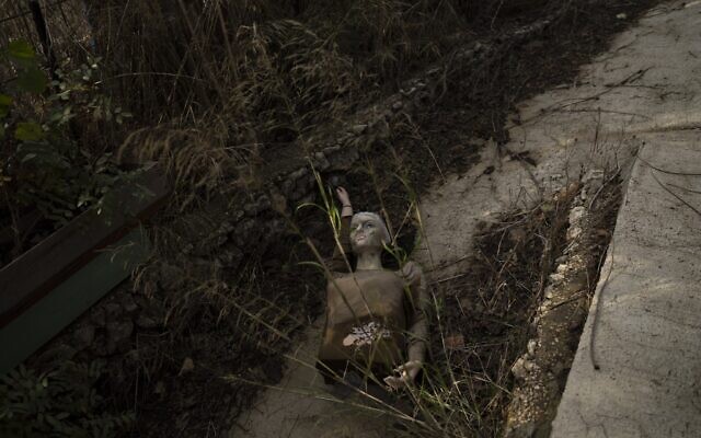 A mannequin lies on the ground of an alley in Kibbutz Manara in northern Israel, November 28, 2024. (AP Photo/Leo Correa)