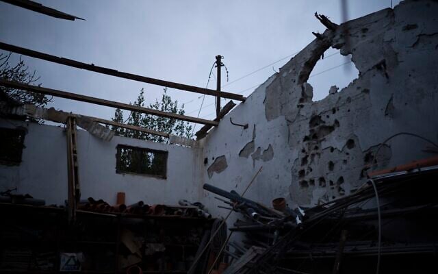 A warehouse that was hit by a rocket fired from Lebanon stands in Kibbutz Malkiya in northern Israel, November 27, 2024. (AP Photo/Leo Correa)