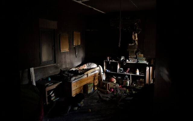 A bed and toys are seen in a bedroom of a house that was hit by a rocket fired from Lebanon, in Kibbutz Manara in northern Israel, November 28, 2024. (AP Photo/Leo Correa)