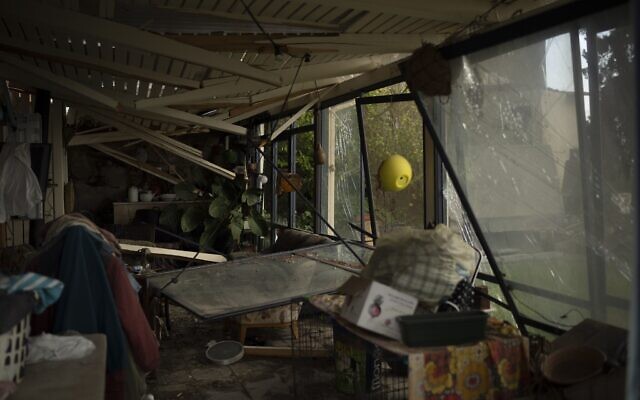 A room damaged by rocket fire is seen in a house in Kibbutz Manara in northern Israel, November 28, 2024. (AP Photo/Leo Correa)