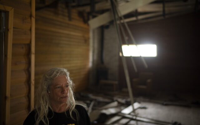 Orna Weinberg stands in a dining hall that was hit by a rocket fired from Lebanon, in Kibbutz Manara in northern Israel, November 28, 2024. (AP Photo/Leo Correa)