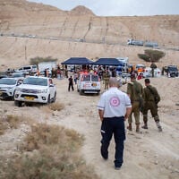 Rescue forces near the scene where young Israelis were swept away in the flooding of the Tzafit riverbed near the Dead Sea in southern Israel, on April 26, 2018. (Maor Kinsbursky/Flash90)