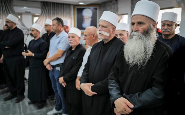 Members of the Druze community attend a funeral in the Druze village of Maghar, on September 20, 2024.  (Michael Giladi/Flash90)