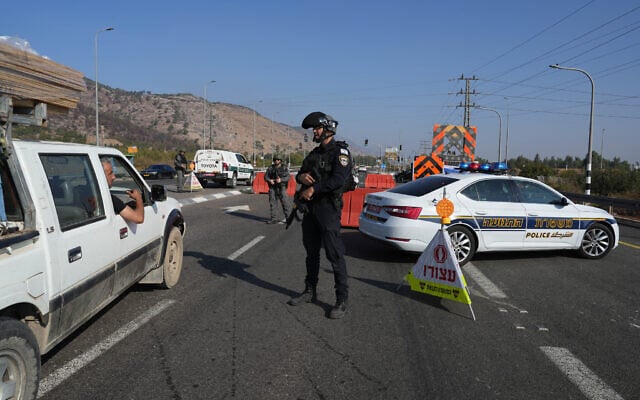 File: Officers guard at a police checkpoint on Highway 90 not far from the border with Lebanon, October 11, 2024 (Ayal Margolin/Flash90) File: Officers guard at a police checkpoint on Highway 90 not far from the border with Lebanon, October 11, 2024 (Ayal Margolin/Flash90)