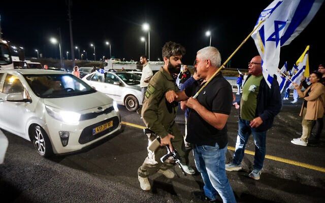Israelis block the Highway 2 near Beit Yanai as they protest against Prime Minister Benjamin Netanyahu's decision to fire Defense Minister Yoav Gallant, November 5, 2024. (Tal Gal/Flash90) Israelis block the Highway 2 near Beit Yanai as they protest against Prime Minister Benjamin Netanyahu's decision to fire Defense Minister Yoav Gallant, November 5, 2024. (Tal Gal/Flash90)