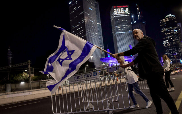 Israelis block the Ayalon Highway in Tel Aviv as they protest against Prime Minister Benjamin Netanyahu's decision to fire Defense Minister Yoav Gallant, November 5, 2024. (Tomer Neuberg/Flash90) Israelis block the Ayalon Highway in Tel Aviv as they protest against Prime Minister Benjamin Netanyahu's decision to fire Defense Minister Yoav Gallant, November 5, 2024. (Tomer Neuberg/Flash90)