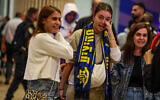 Maccabi Tel Aviv fans who flew on El Al rescue flight from Amsterdam arrive at Ben Gurion international airport, near Tel Aviv, November 8, 2024. (Jonathan Shaul/ Flash90)