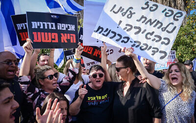 Activist Sheffi Paz, center, surrounded by supporters as she arrives at Neve Tirtza Women's Prison in Ramle to serve her sentence over convictions of vandalism, on November 14, 2024. (Avshalom Sassoni/Flash90)