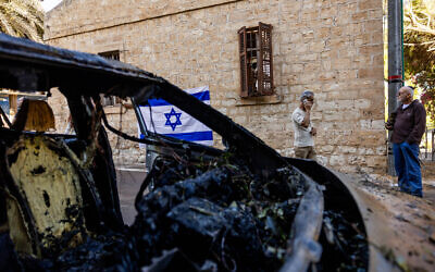 Damage caused to vehicles and buildings from a missile fired from Lebanon on November 16, 2024, in the northern Israeli city of Haifa, photographed on November 17, 2024. (Yonatan Sindel/Flash90)