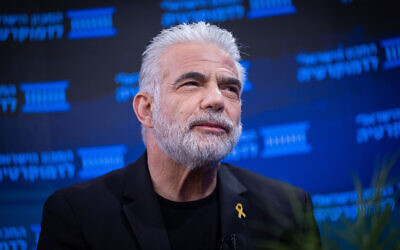 Opposition Leader Yair Lapid attends a conference at the Israel Democracy Institute in Jerusalem, November 20, 2024. (Yonatan Sindel/Flash90)