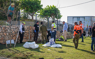 Security and emergency services at the scene where a man was killed by a missile fired from Lebanon, in the northern city of Nahariya, November 21, 2024. (Fadi Amun/Flash90)