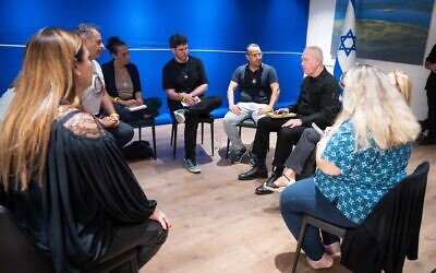 Defense Minister Yoav Gallant meets with the families of fallen soldiers during his last day in office after being fired, on November 7, 2024. (Defense Ministry)