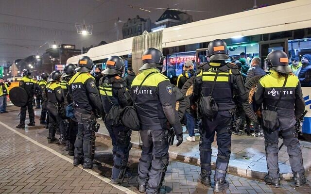 Dutch Police stand guard after attacks on Israeli fans following the soccer game between Ajax and Maccabi Tel Aviv in Amsterdam on November 8, 2024. (VLN Niews / ANP / AFP via JTA) Dutch Police stand guard after attacks on Israeli fans following the soccer game between Ajax and Maccabi Tel Aviv in Amsterdam on November 8, 2024. (VLN Niews / ANP / AFP via JTA)