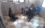 A still image taken from CCTV footage and released by the IDF on November 10, 2024 shows a Palestinian detainee chained by his feet to the ceiling by a Hamas operative in the Gaza Strip. The footage is said by the IDF to document the widespread use of torture by Hamas against its opponents.