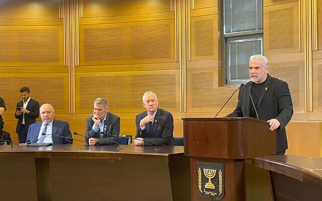 Yesh Atid party head Opposition Leader Yair Lapid, right, speaks at a joint press conference with (R-L) National Unity party head Benny Gantz, The Democrats party head Yair Golan, and Yisrael Beytenu party Avigdor Liberman at the Knesset in Jerusalem on November 6, 2024. (Sam Sokol/Times of Israel)