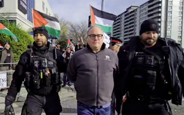 Conservative commentator Ezra Levant is arrested at an anti-Israel, pro-Hamas rally in Toronto, November 24, 2024. (Screenshot: Rebel News, used in accordance with Clause 27a of the Copyright Law)
