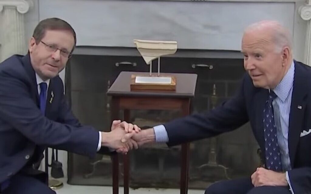 President Isaac Herzog, left, shakes hands with US President Joe Biden in the Oval Office on November 12, 2024. (Screen capture/YouTube)