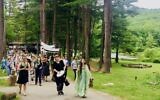 A Shavuot parade at the Isabella Freedman Jewish Retreat Center, a Hazon-operated complex in Falls Village, Conn. (Courtesy of Pearlstone via JTA)