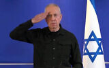 Defense Minister Yoav Gallant salutes as a sign of respect to Israel's security forces at the end of a press conference after he was fired by Prime Minister Benjamin Netanyahu, at the Ministry of Defense in Tel Aviv, November 5, 2024. (Screen capture)