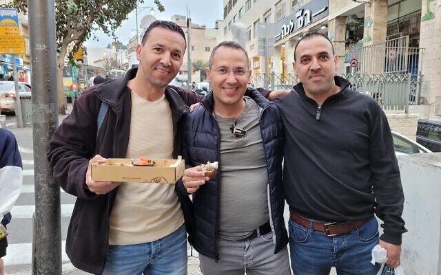 Brothers Yossi, Sharon and Eli Sharabi before October 7, 2023 when Yossi and Eli were taken hostage to Gaza. Yossi died in captivity (Courtesy)