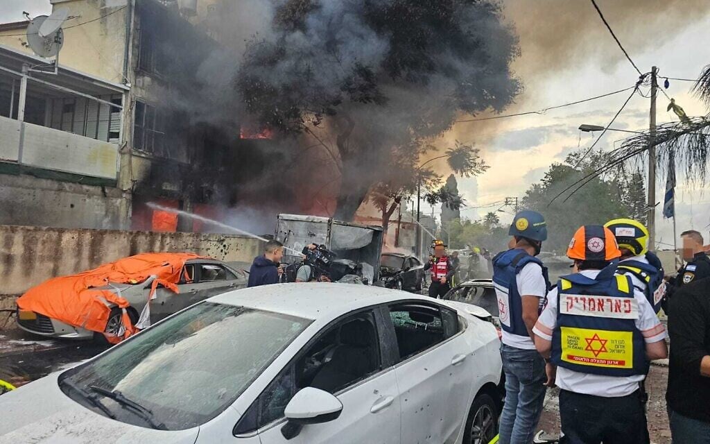 Emergency services survey the damage in Kiryat Ata after a major barrage of rockets was fired at the Haifa Bay area, November 11, 2024. Emergency services survey the damage in Kiryat Ata after a major barrage of rockets was fired at the Haifa Bay area, November 11, 2024.