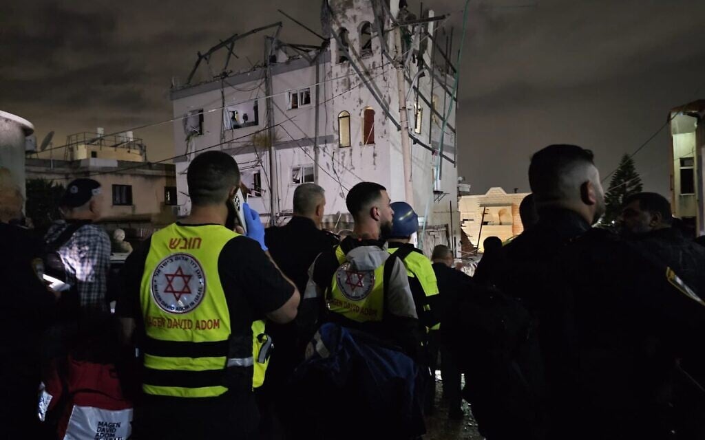 Medics at the scene of a deadly Hezbollah rocket impact in Shfar'am, northern Israel, November 18, 2024. (Magen David Adom)