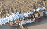 Humanitarian aid is distributed in northern Gaza's Jabalia and Beit Hanoun, in a handout photo published November 9, 2024. (Israel Defense Forces)