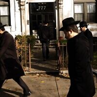 Illustrative: Men walking in Crown Heights, Brooklyn, New York, in 2017. (Amir Levy/ Getty Images/ File)