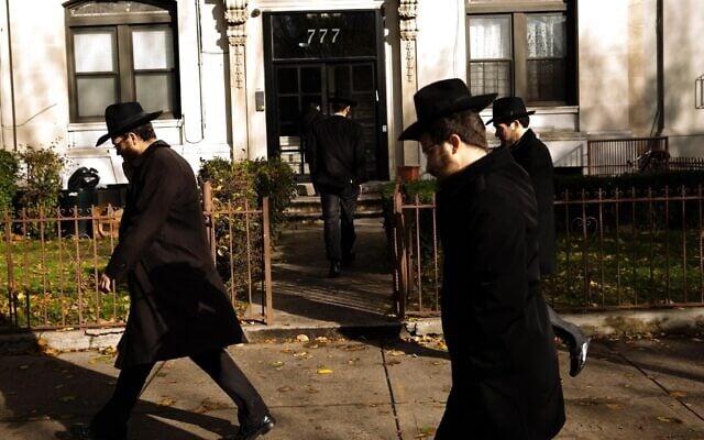 Illustrative: Men walking in Crown Heights, Brooklyn, New York, in 2017. (Amir Levy/Getty Images)