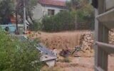 Floodwaters seen in Zichron Yaakov on November 19, 2024. (screen capture: Telegram)