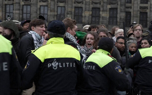 Dutch police break up an anti-Israel demonstration held in defiance of a temporary ban on protests following antisemitic riots after an Israeli soccer team's game in Amsterdam, on November 10, 2024. (Nacho Calonge/AFPTV/AFP)