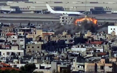 Footage shows an Israeli airstrike in the vicinity of Beirut’s international airport, as a passenger plane is seen taxiing in the background on November 14, 2024 (Screencapture: X  used in accordance with Clause 27a of the Copyright Law)