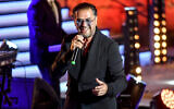 Lebanese singer Ragheb Alama performs during the 57th session of the International Festival of Carthage (FIC,) at the Roman Theatre of Carthage on the outskirts of Tunis on August 5, 2023. (Photo by FETHI BELAID / AFP)