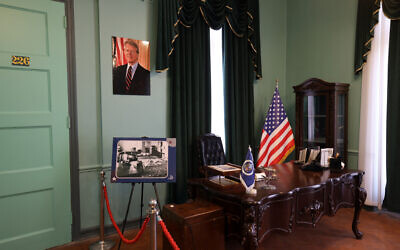 A portrait of former US president Jimmy Carter adorns wall of the US ambassador's former office in the building that had housed the embassy of the United States in Tehran, Iran, now dubbed the "Den of Spies" museum, on October 25, 2023. (Photo by ATTA KENARE / AFP)