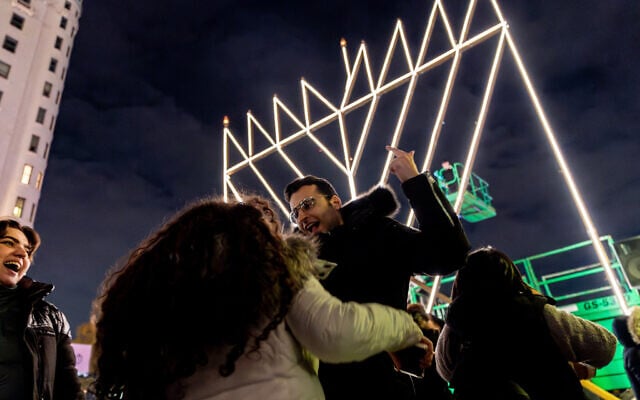 Celebrants gather at the world's largest Hanukkah menorah at Fifth Avenue and 59th Street at Central Park for the first night of Hanukkah on December 7, 2023, in New York City. (David Delgado/Getty Images/AFP) Celebrants gather at the world's largest Hanukkah menorah at Fifth Avenue and 59th Street at Central Park for the first night of Hanukkah on December 7, 2023, in New York City. (David Delgado/Getty Images/AFP)