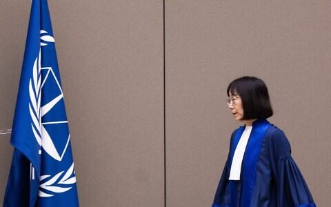 File: Judge Tomoko Akane arrives prior to the announcement of the International Criminal Court (ICC) verdict that sentenced Malian Jihadist police chief Al Hassan Ag Abdoul Aziz Ag Mohamed Ag Mahmoud to 10 years in jail for war crimes and crimes against humanity committed during a reign of terror in the fabled Malian city of Timbuktu, on November 20, 2024 at the court in The Hague, the Netherlands. (Eva Plevier / various sources / AFP)