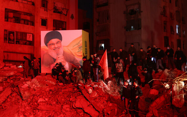 Mourners attend a vigil to honor Hezbollah's late chief Hassan Nasrallah, at the site where he was killed in an Israeli air strike, in the Haret Hreik neighborhood of Beirut's southern suburbs on November 30, 2024. (IBRAHIM AMRO / AFP) Mourners attend a vigil to honor Hezbollah's late chief Hassan Nasrallah, at the site where he was killed in an Israeli air strike, in the Haret Hreik neighborhood of Beirut's southern suburbs on November 30, 2024. (IBRAHIM AMRO / AFP)