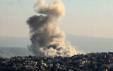 In this picture taken from Marjayoun, thick smoke rises from explosions in the border town of Khiam in southern Lebanon, on December 1, 2024. (Photo by AFP)