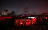 Smoke rises during an Israeli strike near a makeshift camp for displaced Palestinians, in the Khan Younis area in southern Gaza on December 4, 2024. (Bashar Taleb/AFP)