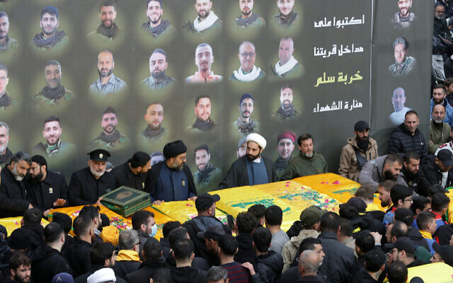 Mourners take part in the funeral procession of Hezbollah fighters who were killed during the recent war with Israel, in the southern Lebanese village of Kherbet Selm on December 4, 2024. (MAHMOUD ZAYYAT / AFP)