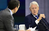 Former US president Bill Clinton (R) speaks onstage during The New York Times Dealbook Summit 2024, in New York City, December 4, 2024. (Eugene Gologursky/Getty Images North America/Getty Images via AFP)
